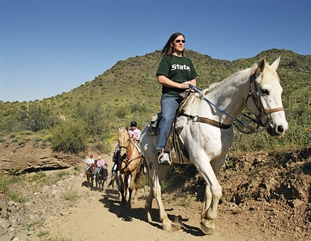 Cave_Creek_Regional_Park_-_Visitors_enjoying_a_leisurely_horseback_ride