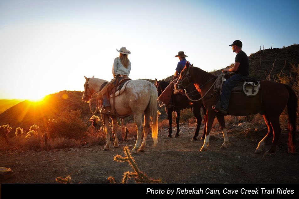Three riders on horses along the Go John Trail at Cave Creek Regional Park. Photo by Rebekah Cain from Cave Creek Trail Rides.
